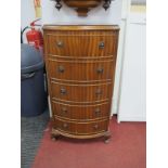 A XX Century Mahogany Bow Fronted Chest of Drawers, with five small drawers on small cabriole