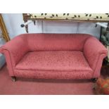 An Early XX Century Drop Arm Settee, upholstered in a maroon floral velvet, 169cm.