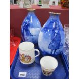 A Pair of Doulton Blue & White Pictorial Vases, featuring girls in Winter and Autumn settings, (