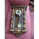 A XIX Century Walnut Viennese Wall Clock, with split side pilasters.