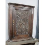 A XIX Century Carved Flat Fronted Corner Cupboard, with one internal shelf.