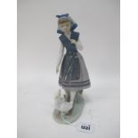 A Lladro Figurine of Girl Following Geese, stamped 5202, B-12D, 26.5cm high.