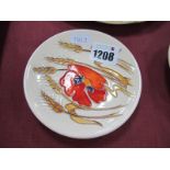 A Moorcroft Pottery Coaster, painted in the Harvest Poppy design by Emma Bossons, shape 780/4,