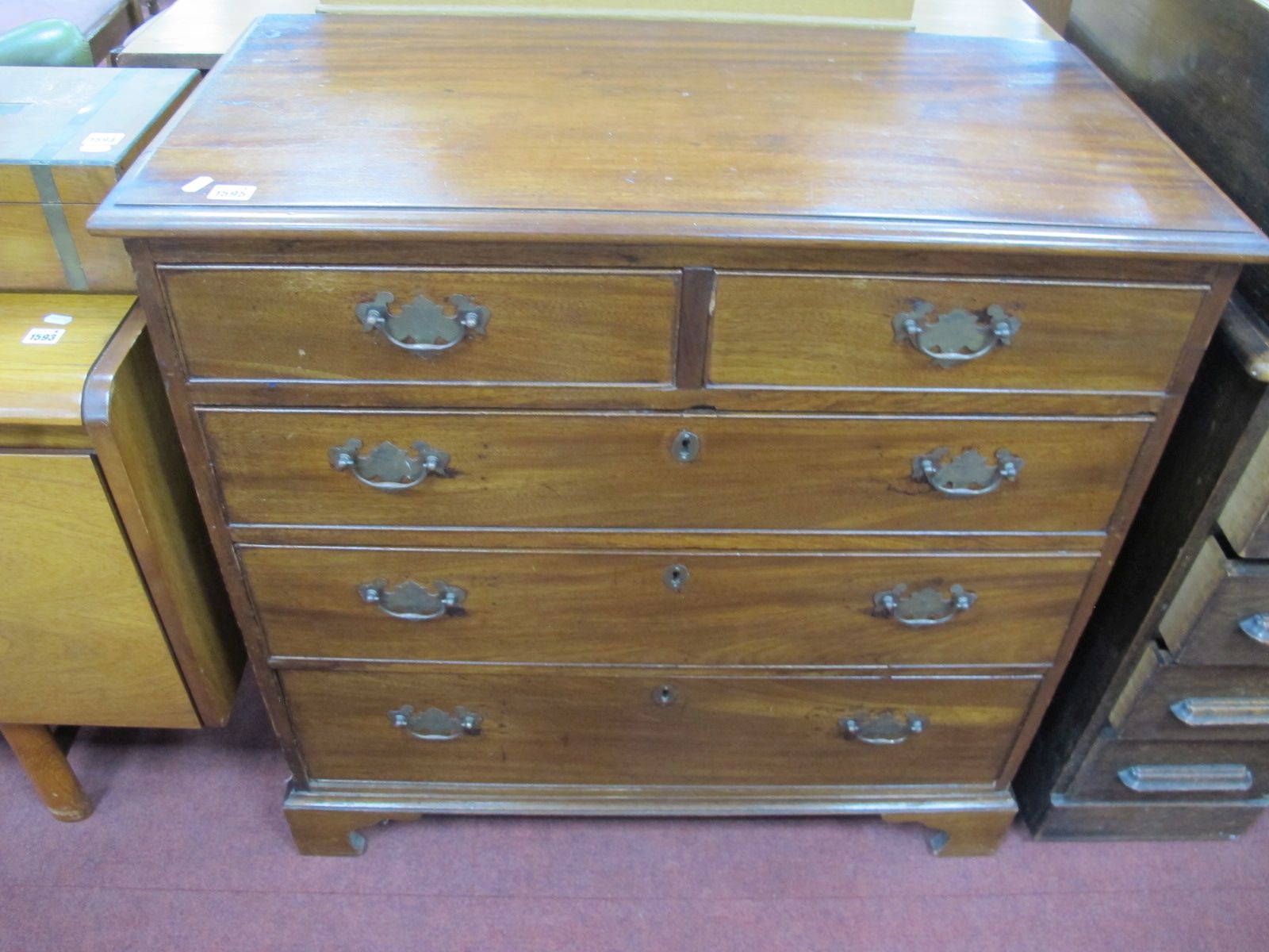 An XVIII Century Mahogany and Pine Chest of Drawers, the top with a moulded edge, two small drawers,