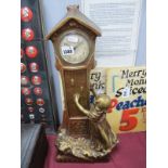 Art Nouveau Continental Plaster Mantle Clock, of a girl by the side of a long case clock, with