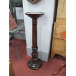 A XX Century Mahogany Jardiniere Stand, with a circular top, reeded and turned pedestal on a