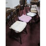 A Set of Kitchen Chairs, with shaped rail, rail supports on turned legs united by stretchers.