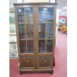 1930's Oak Display Cabinet, with stepped pediment, full length glazed and panelled doors, on bracket