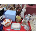 Four Nao Figurines, Poole butter dish, Wedgwood Clarice Cliff orange Taormina teapot, Doulton Jug.