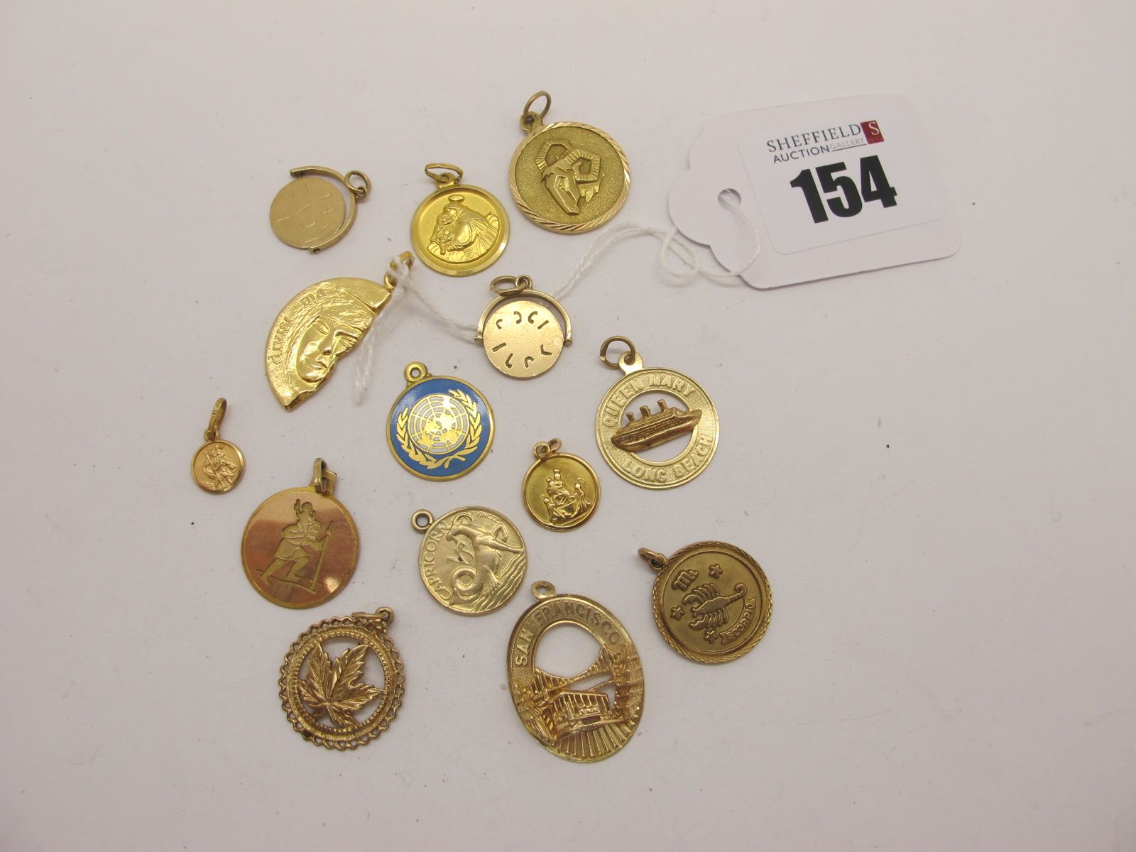 14K, "750", and Other Assorted Pendants.