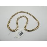 A 9ct Gold Flat Curb Link Chain, 57.5cm long.