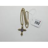 An Antique Style Cross Pendant, with claw and collet set highlights, stamped "375", on a belcher