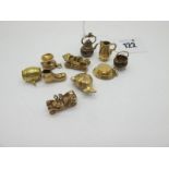 Ten 9ct Gold Novelty Charm Pendants, including vintage style motorcars, fish, kettle, etc.