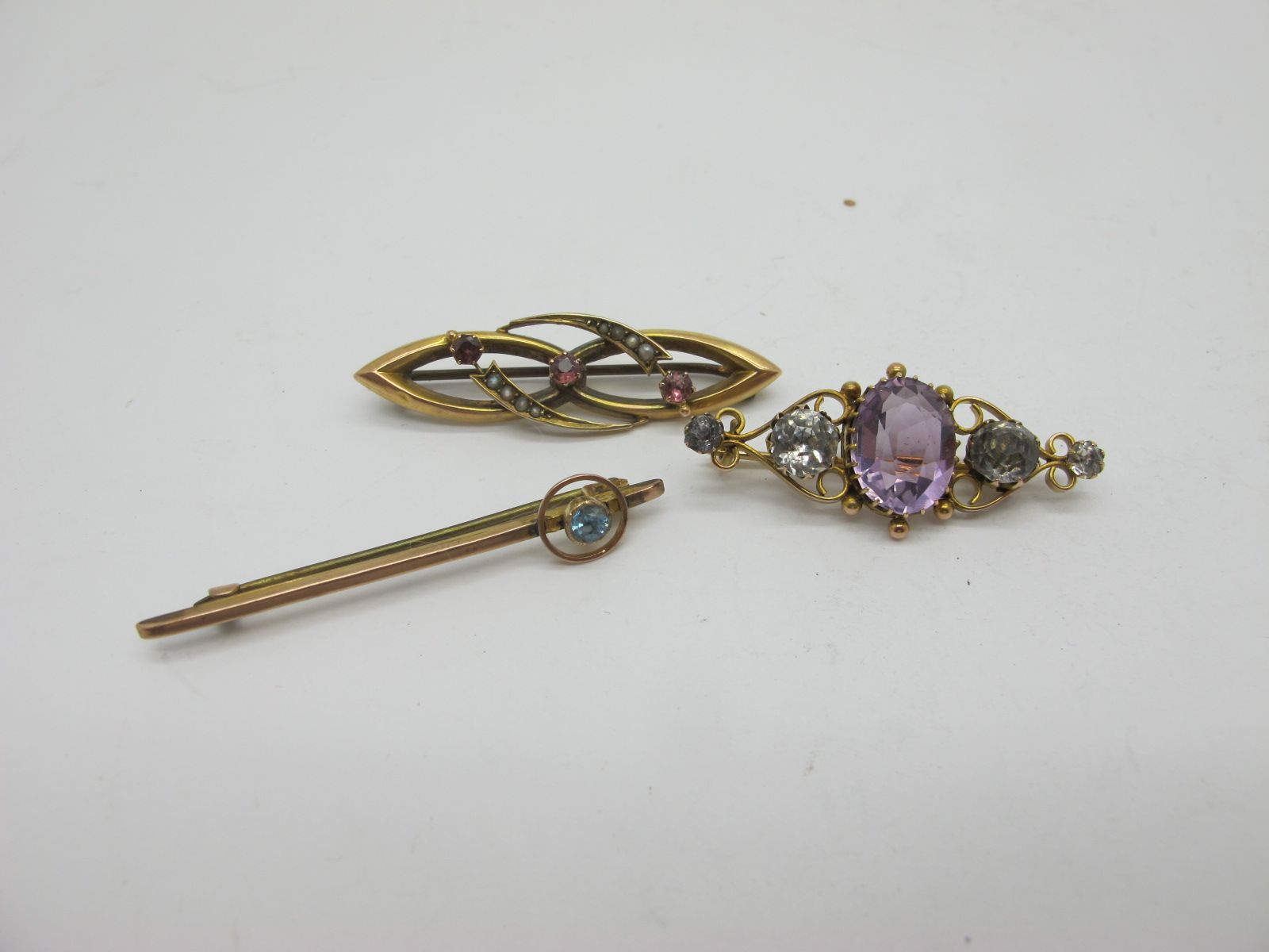 An Ornate 9ct Gold Claw Set Brooch, of openwork scroll design, another similar with seed pearl