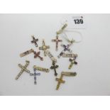 Ten Modern Cross Pendants, each with inset highlights, stamped "375". (10)