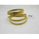 Six High Carat Indian Bangles, with engraved decoration. (6)