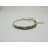 A Victorian Style 9ct Gold Sapphire and Diamond Set Bangle, of graduated design, alternately set,