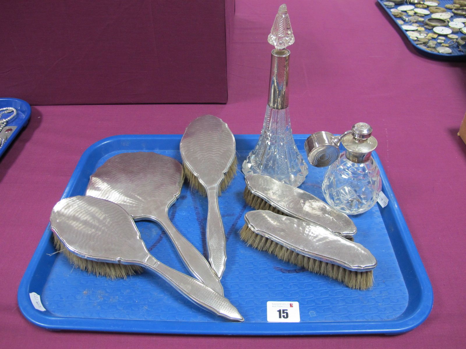 A Hallmarked Silver Backed Five Piece Dressing Table Set, with engine turned decoration; together