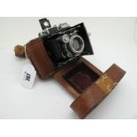 Zeiss Ikon Bellow Camera, with a Tessar 1-35 Lens, in leather case.