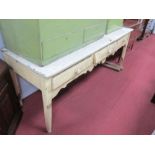 A XIX Century Painted Pine Dresser Base, with three small drawers, shaped apron, on tapering legs,