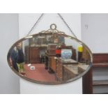 Early XX Century Brass Oval Framed Bevelled Wall Mirror, 69cm wide, another with split pilasters. (