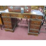 A Mahogany Pedestal Desk, with a cross banded top, leather scriver, three top drawers, twin