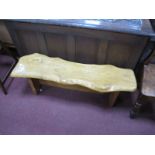 A Wooden Bench, possibly Elm with naturalistic top, on trestle supports, 108cm wide.