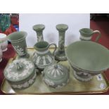 Wedgwood Green Jasper Ware Pottery, of eight pieces including pair of candlesticks, 17cm high, jugs,