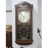 1940's Wall Clock, with silver dial, Arabic numbers, glazed astragel doors.