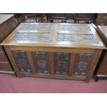 An Early XX Century Carved Oak Blanket Box, with a carved lozenge top, four panelled base, with