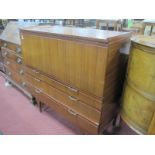 A Teak Bureau Circa Mid XX Century, with fall front over two small and two long drawers, on tapering