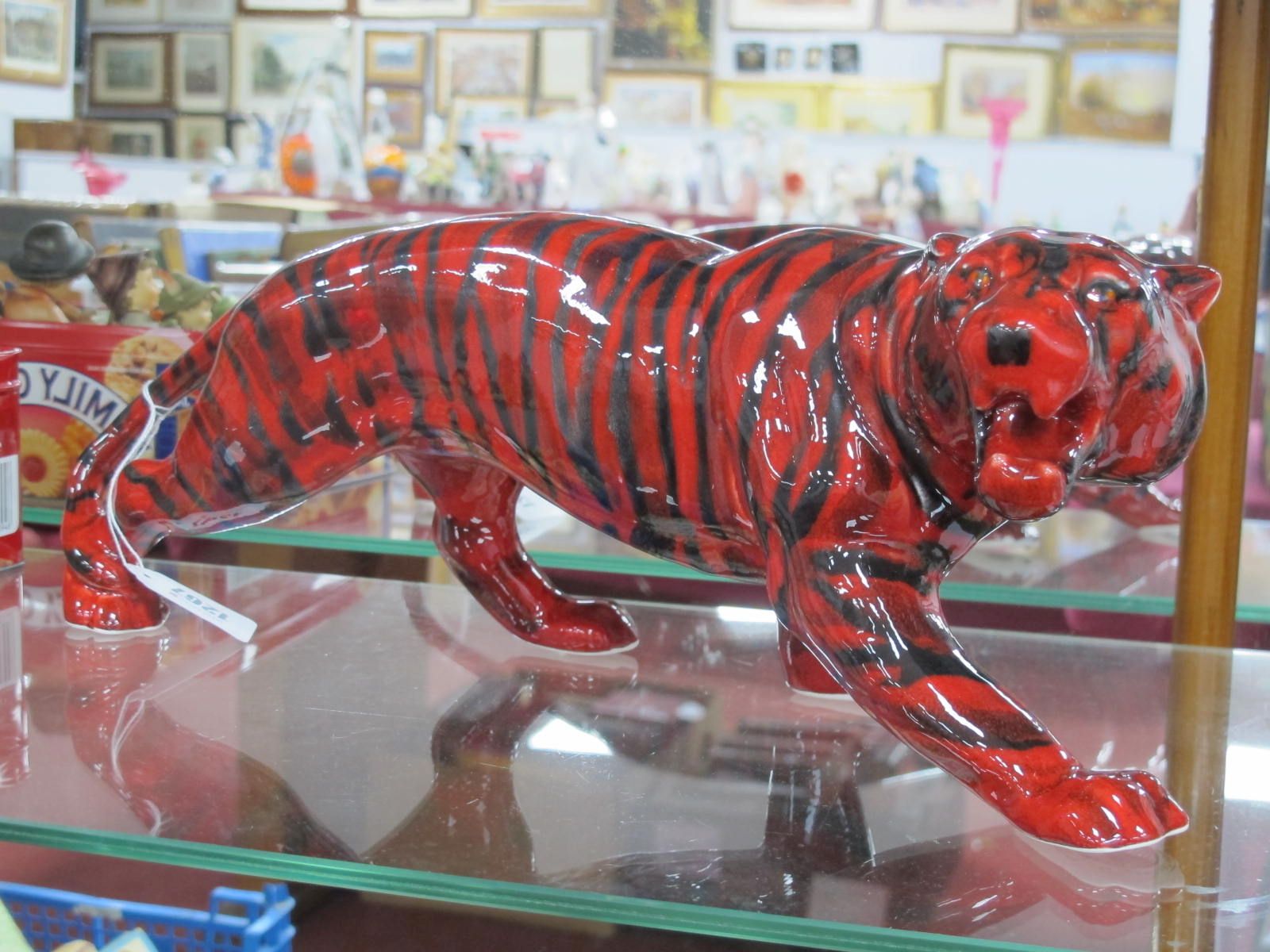 An Anita Harris Model of a Bengal Tiger, in ruby and black, gold signed, 40cm long, 14.5cm high.