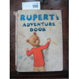Rupert's Adventure Book, 1940, tears and loss to spine and page nine torn, ink named and dated to