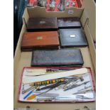 Four Victorian Boxed Sets of Drawing Instruments, one dated 1887, plus a later set and a tray of