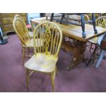 A XX Century Pine Refectory Table; together with six wheel back Windsor chairs.