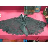 A Victorian Lace Mourning Capelet, with tapework floral design inset with jet beads, pleated
