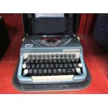 Imperial Good Companion Portable Typewriter, in a brown case.