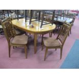 A Teak 'D' Ended Extending Dining Table, circa 1970's with fold out centre leaf, on tapering legs,