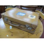 An Early XIX Century Heavy Quality Tan Leather Suitcase, with studded leather reinforced corners and