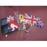 A Union Jack Flag, Welsh Flag on a stick, etc, in a brown case.