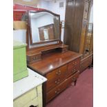 An Edwardian Inlaid Mahogany Dressing table, with a central mirror, with two short drawers, two long