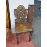 A XIX Century Carved Oak Hall Chair, with open mask back.