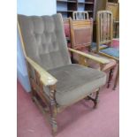 Oak Arts and Crafts Easy Chair, with shaped arm supports, barley twist and block legs, united by 'N'
