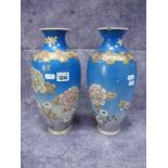 A Pair of Japanese Satsuma Vases, circa 1900 with chrysanthemum decoration on a blue ground with