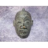 African Carved wooden Mask, possibly Boka, having Mohican tuft of hair and circles to forehead, 25 x