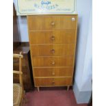A Light Oak and Teak Oak Slender Chest, circa 1960's, with concave turned handles, to six drawers,