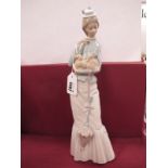 Lladro 'Lady Holding Pekinese Dog', 36.5cm high.