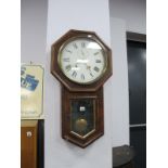 A XIX Century Rosewood Wall Clock, with a circular white dial, Roman numerals, minute dial, over a