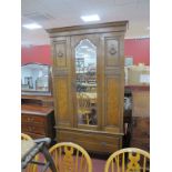 A 1920's Oak Wardrobe, single door, single drawer, on turned feet.