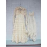A Circa 1950's Cream Lace Wedding Dress, with sweetheart neckline and full tiered skirt, matching